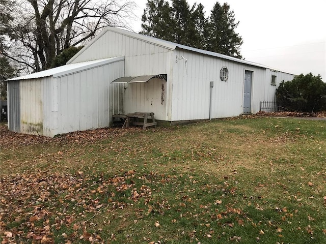 view of outdoor structure featuring a lawn