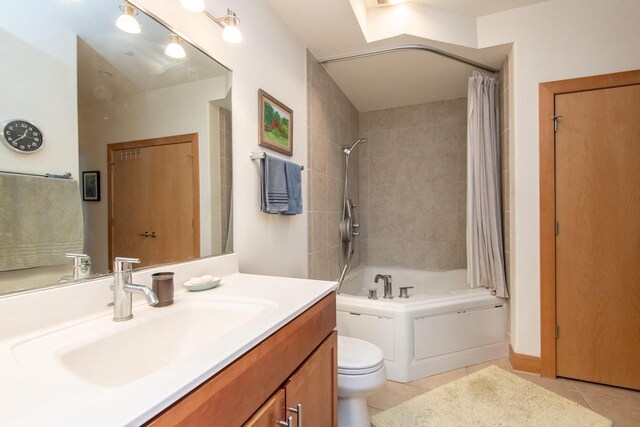 full bathroom featuring tile patterned floors, vanity, toilet, and shower / tub combo with curtain