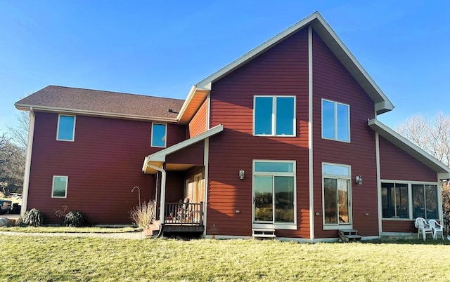 rear view of house with a lawn