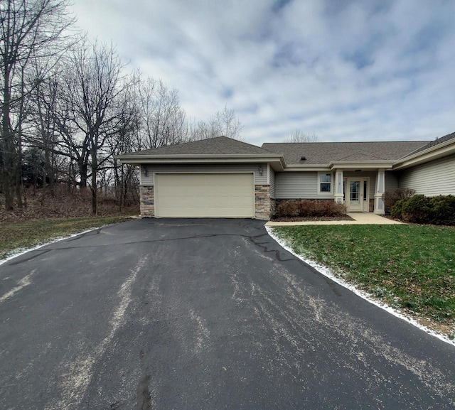 view of front facade with a garage and a front yard