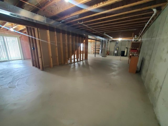 basement featuring water heater