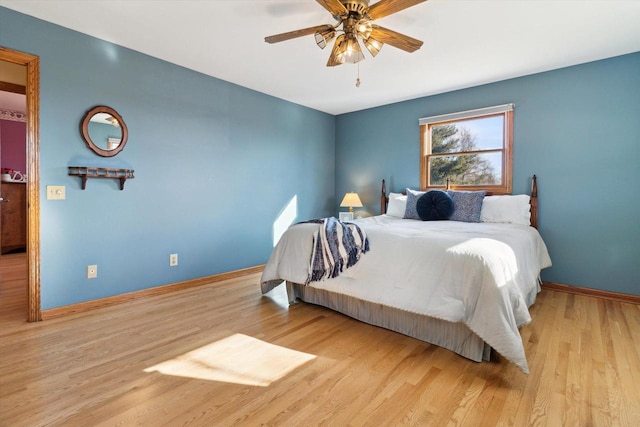 bedroom with ceiling fan and light hardwood / wood-style flooring