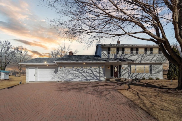 view of front of home with a garage