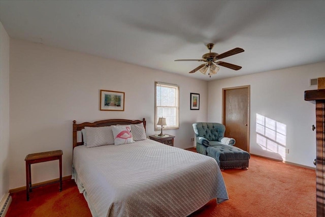 carpeted bedroom with baseboard heating and ceiling fan