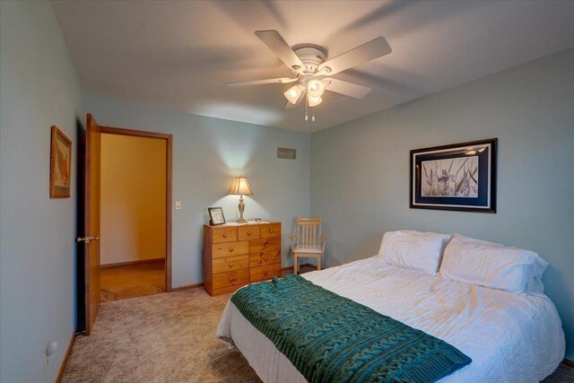 bedroom featuring ceiling fan and light colored carpet