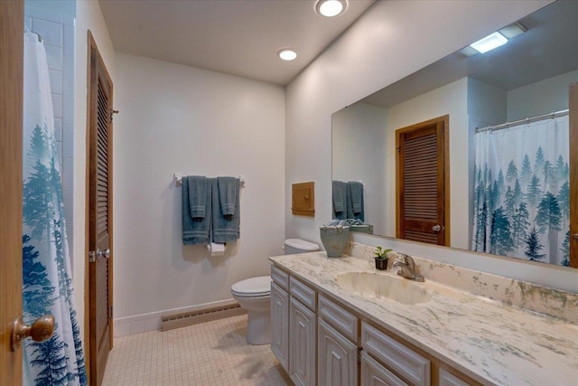 bathroom with tile patterned flooring, vanity, toilet, and baseboard heating