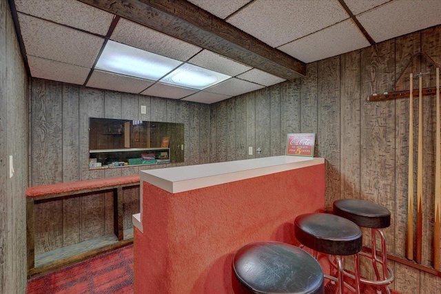 bar featuring a paneled ceiling