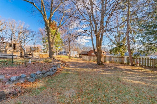 view of yard featuring a wooden deck