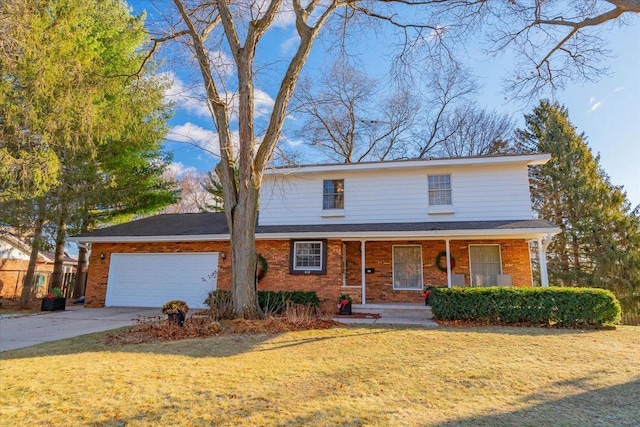 view of front property with covered porch, a garage, and a front lawn