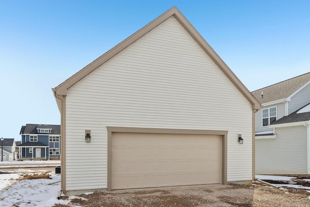 view of snow covered garage