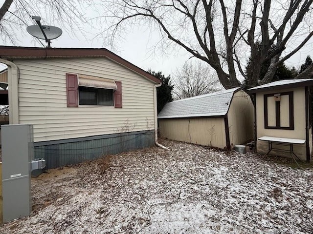 view of property exterior with a storage shed