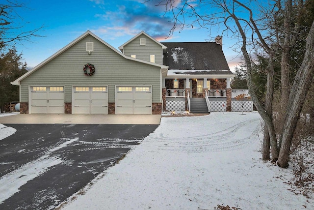 view of front of property featuring a garage and covered porch