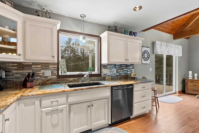 kitchen with tasteful backsplash, stainless steel dishwasher, sink, light hardwood / wood-style flooring, and white cabinets