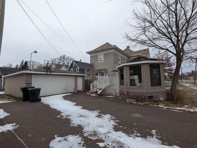 view of front property with a garage and an outdoor structure