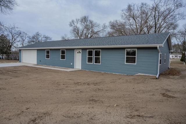 ranch-style home featuring a garage