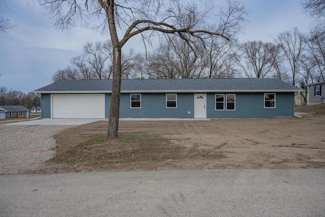 single story home featuring a garage