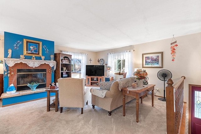 carpeted living room featuring a fireplace