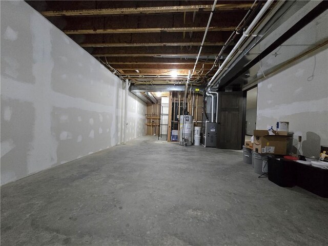 basement with gas water heater and heating unit