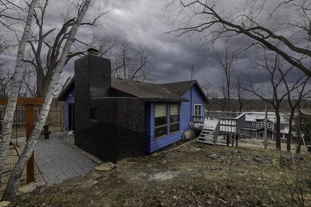 view of side of property with a deck