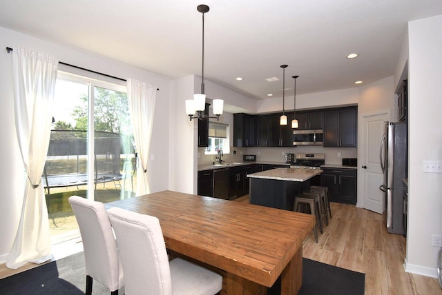 dining room featuring light hardwood / wood-style floors and sink