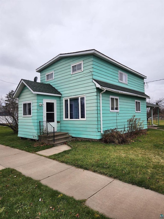 view of front of home with a front yard