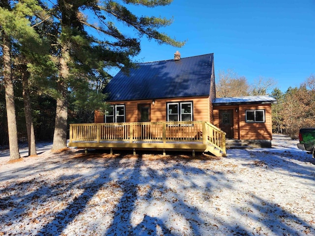 log cabin featuring a wooden deck