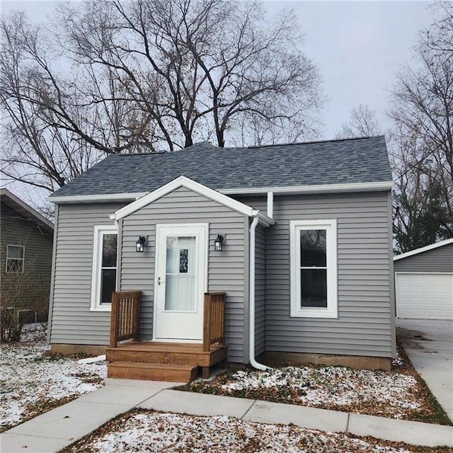 view of front of house with an outbuilding and a garage