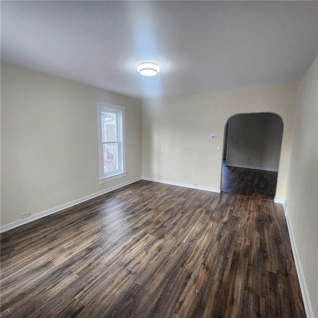 empty room with dark hardwood / wood-style floors