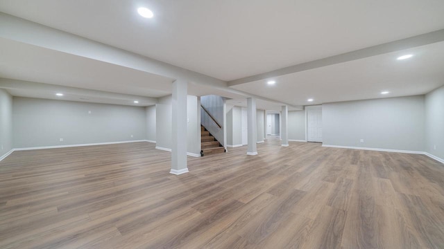 basement featuring light hardwood / wood-style flooring