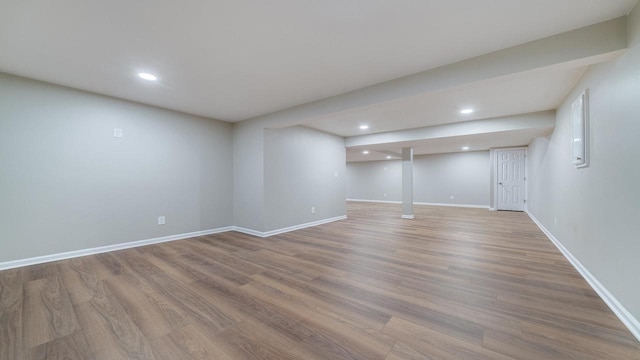 basement featuring light hardwood / wood-style flooring