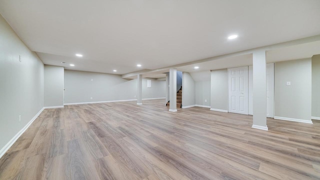 basement featuring light wood-type flooring