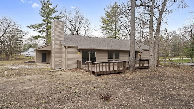 back of house featuring a wooden deck