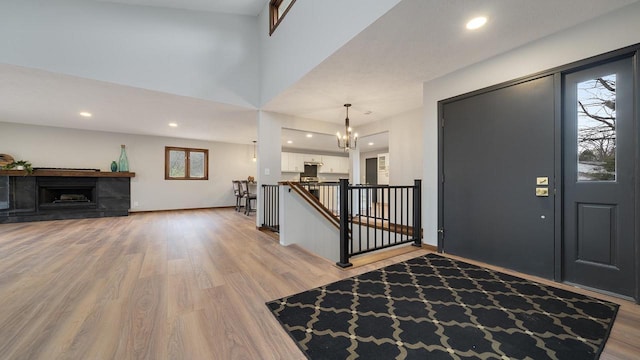 entrance foyer with a chandelier and light wood-type flooring