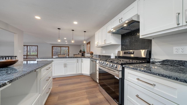 kitchen featuring pendant lighting, exhaust hood, white cabinets, light wood-type flooring, and appliances with stainless steel finishes