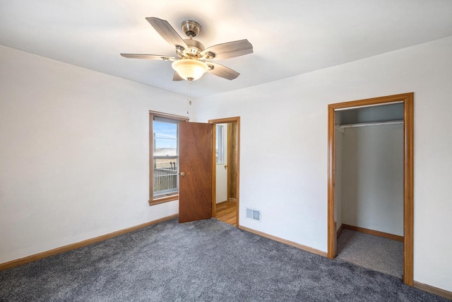 unfurnished bedroom featuring carpet flooring, ceiling fan, and a closet