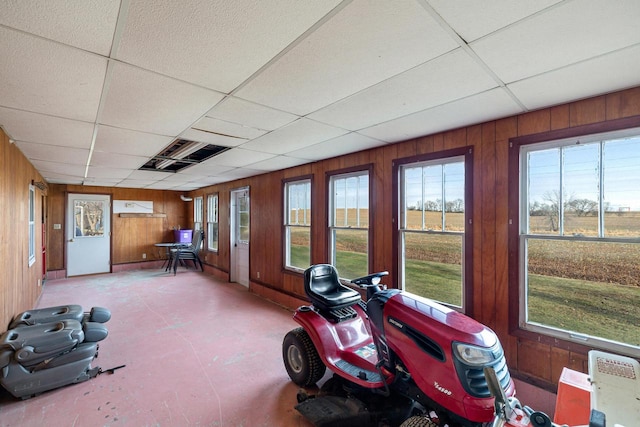 sunroom / solarium featuring a drop ceiling