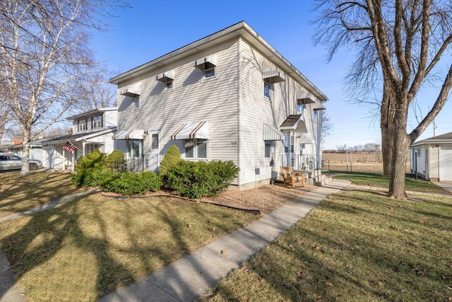 view of home's exterior with a lawn