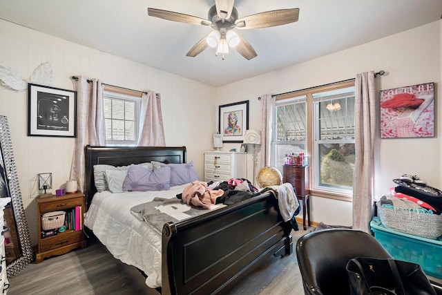 bedroom with hardwood / wood-style flooring and ceiling fan