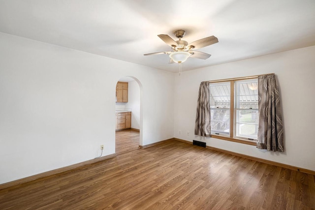 unfurnished room with ceiling fan and light hardwood / wood-style floors