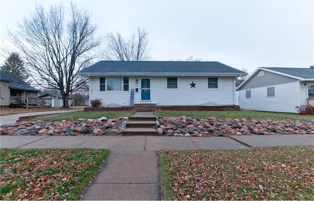 307 W Humbird St, Rice Lake, WI 54868 - ranch-style house featuring a front lawn