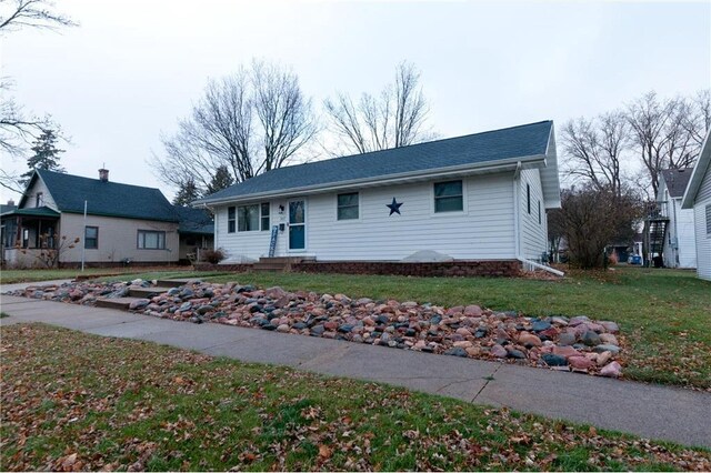 307 W Humbird St, Rice Lake, WI 54868 - ranch-style home featuring a front yard