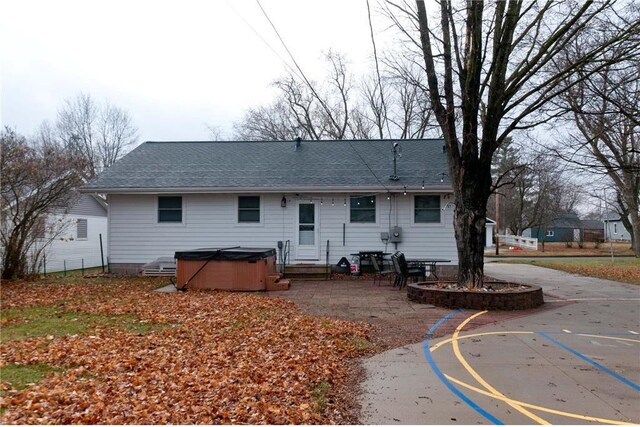 307 W Humbird St, Rice Lake, WI 54868 - rear view of property with basketball court and a hot tub