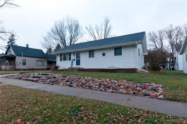 ranch-style home with a front yard