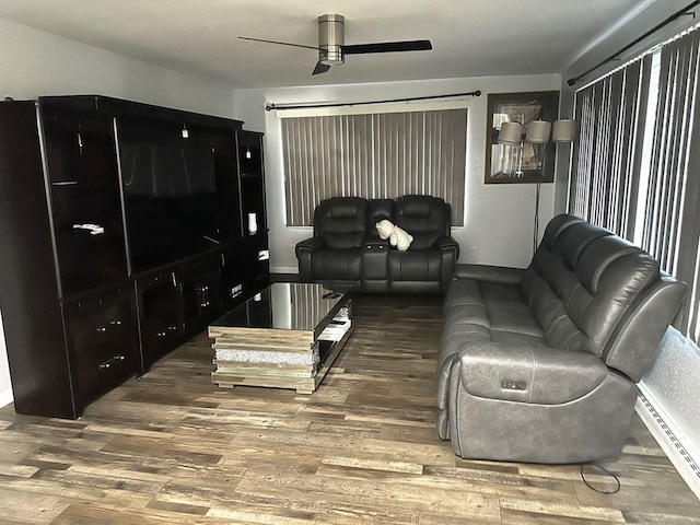 living room with hardwood / wood-style floors and ceiling fan