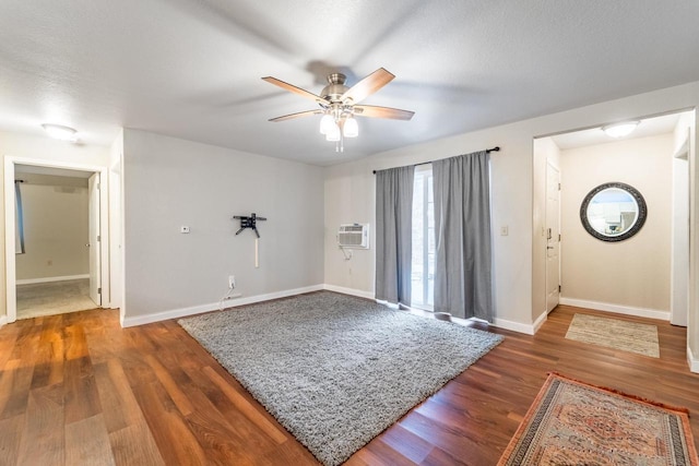 entrance foyer with dark hardwood / wood-style floors, ceiling fan, and a textured ceiling