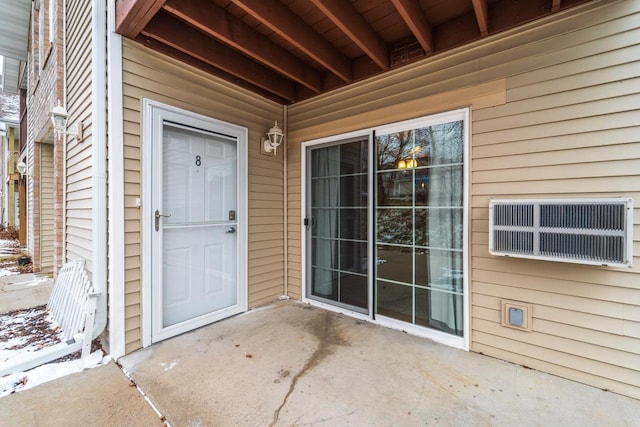 doorway to property featuring a patio area