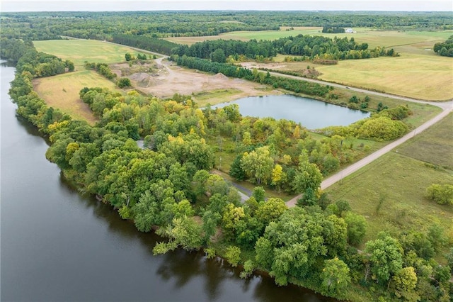 birds eye view of property featuring a rural view and a water view