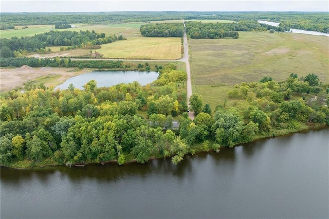 birds eye view of property featuring a water view and a rural view