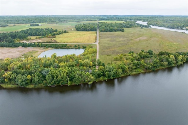 birds eye view of property with a water view and a rural view