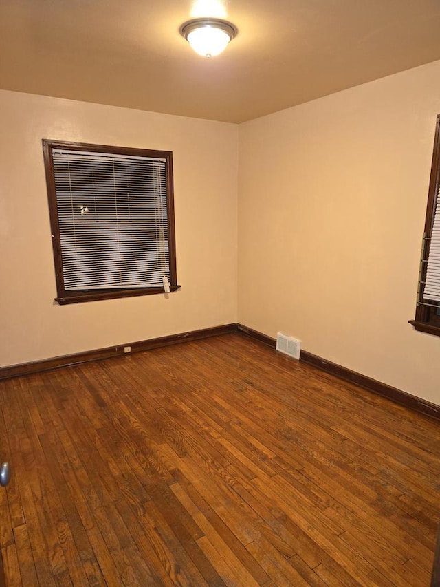 empty room featuring hardwood / wood-style flooring